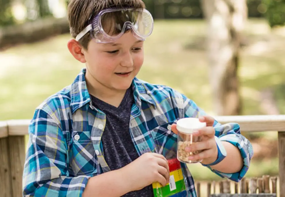 Elementary student wearing a pair of goggles