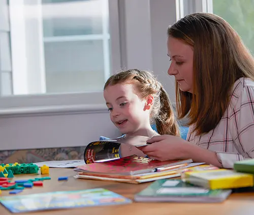 Mother and daughter doing homework together